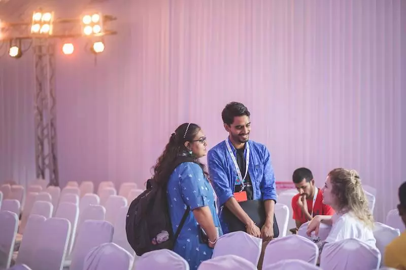 A hallway conversation at React India